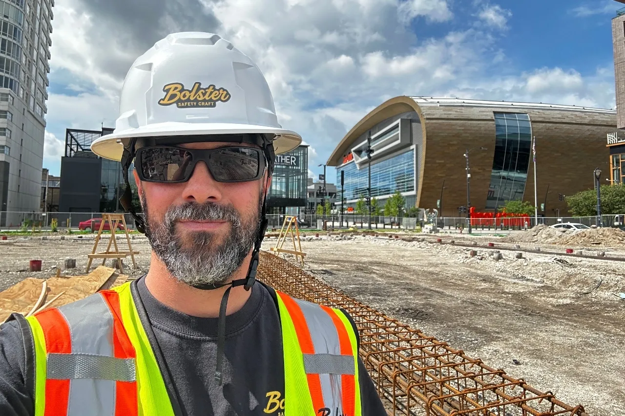 Safety consultant wearing Bolster Safety Craft protective equipment at an active construction site